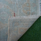 1970s brown vintage turkish rug with neutral design, hand-knotted weave and low pile.