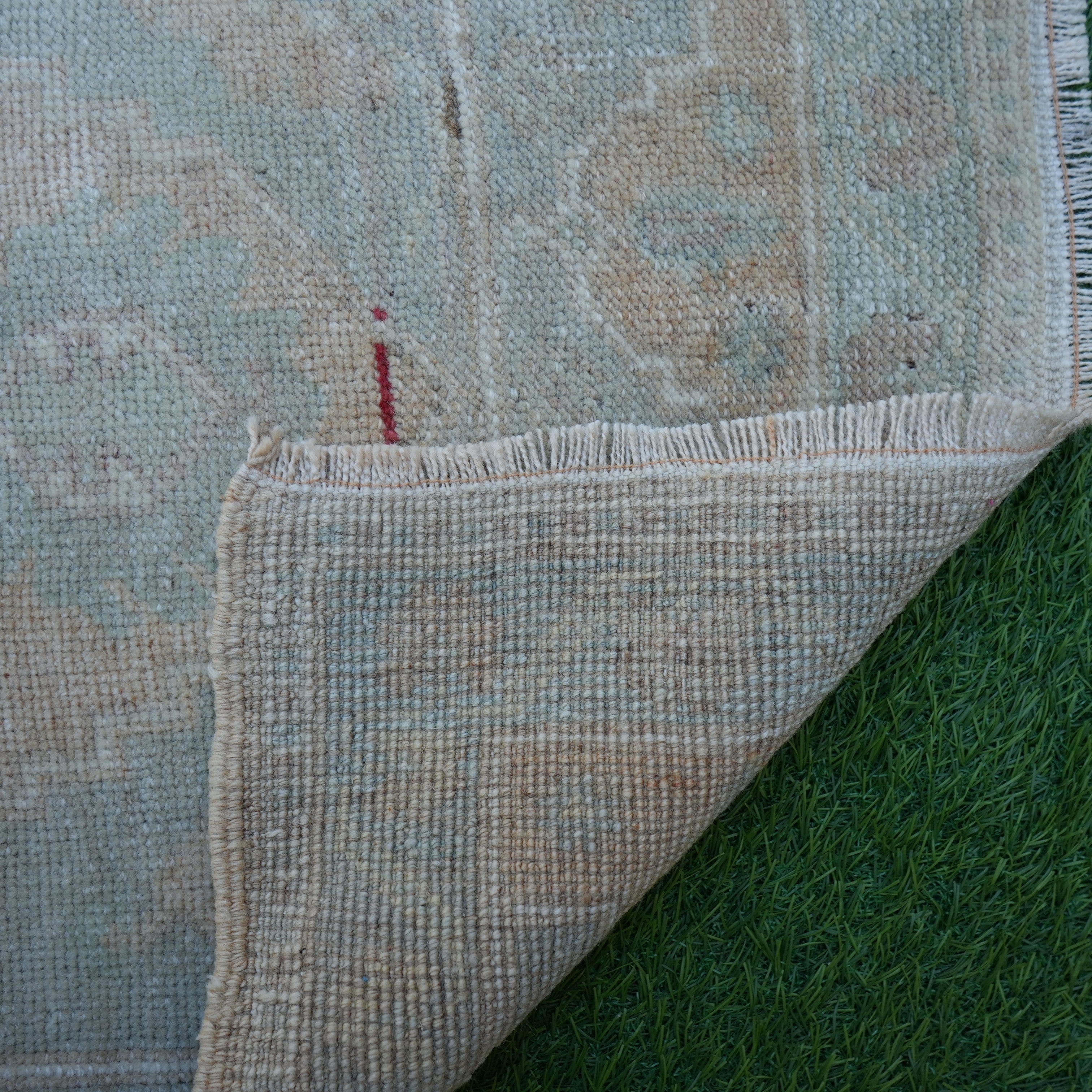 1970s brown vintage turkish rug with neutral design, hand-knotted weave and low pile.