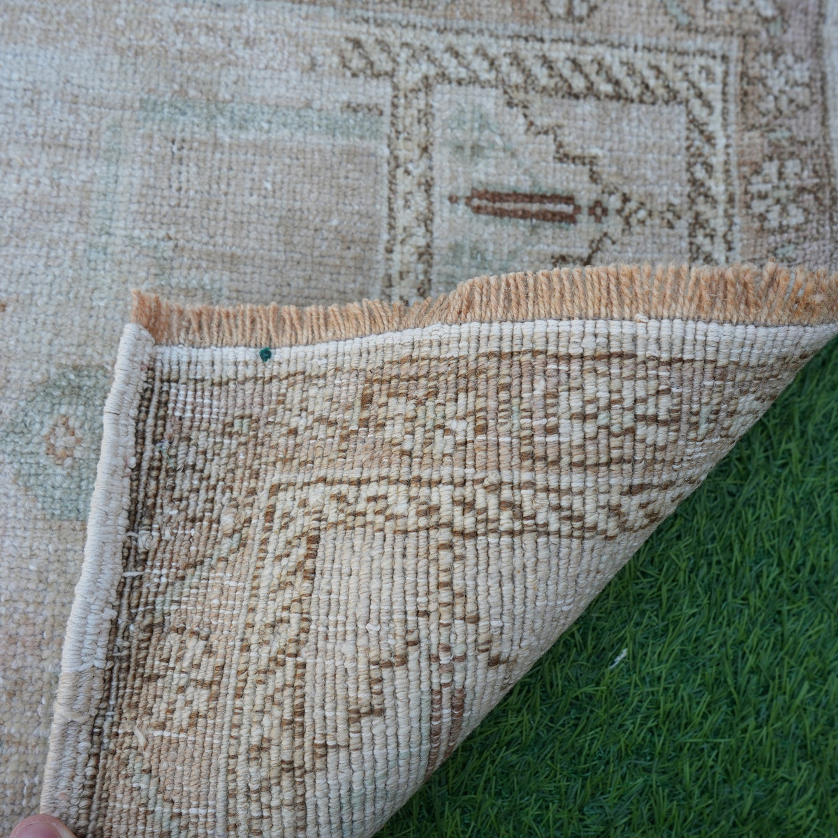 1970s brown vintage turkish rug with neutral design, hand-knotted weave and low pile.