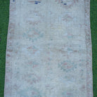 Close-up of the brown vintage turkish rug showing neutral details, hand-knotted weave, wool and cotton and low pile.