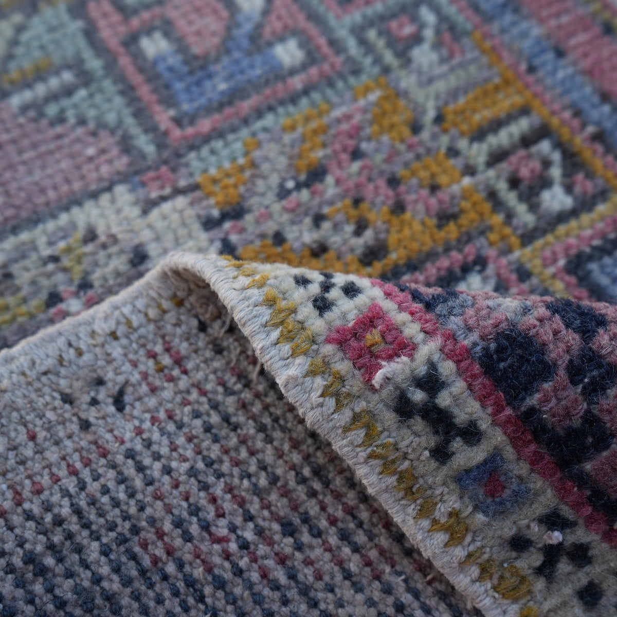 1970s pale red vintage turkish rug with traditional design, hand-knotted weave and low pile.