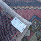 Additional view of the pale red vintage turkish rug, hand-knotted in wool and cotton.