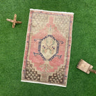 Pink 2' x 3' vintage turkish rug with geometric design, handmade in Turkey – Baxter.