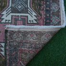 1970s pink vintage turkish rug with traditional design, hand-knotted weave and low pile.