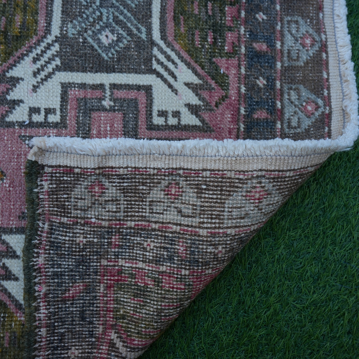 1970s pink vintage turkish rug with traditional design, hand-knotted weave and low pile.