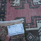 Pink 2' x 3' vintage turkish rug from the 1970s with traditional design.