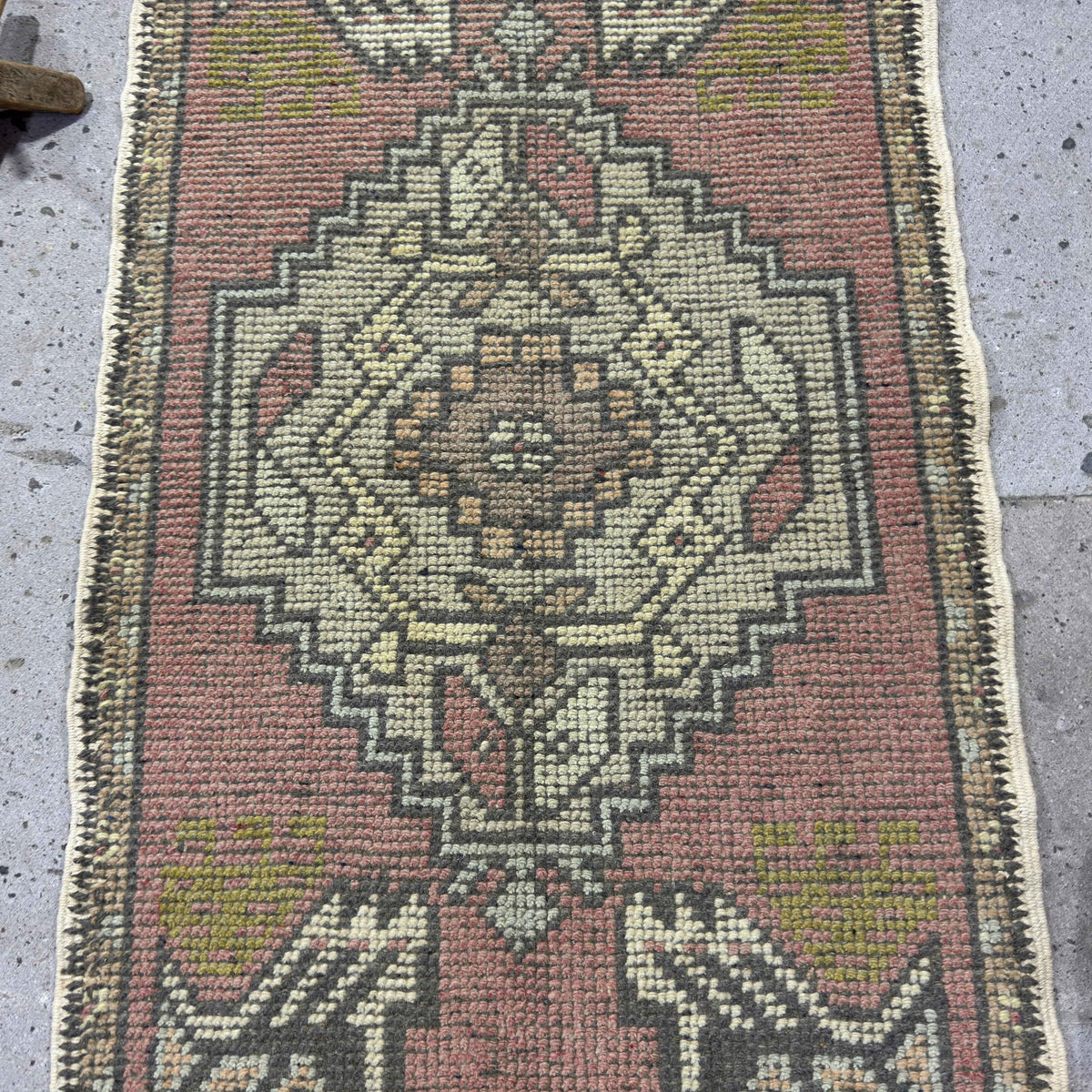 1970s pink vintage turkish rug with traditional design, hand-knotted weave and low pile.