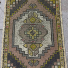 1970s pink vintage turkish rug with traditional design, hand-knotted weave and low pile.