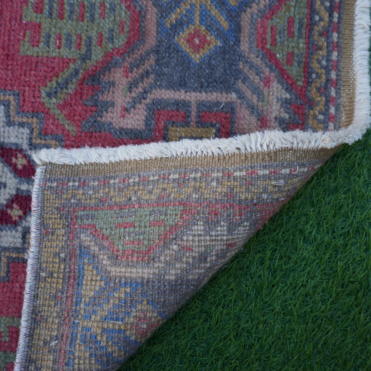 1970s red vintage turkish rug with traditional design, hand-knotted weave and low pile.