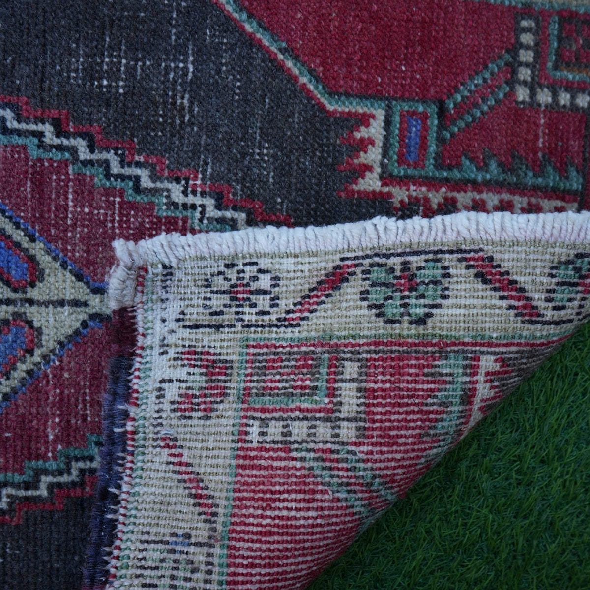 1970s red vintage turkish rug with traditional design, hand-knotted weave and low pile.