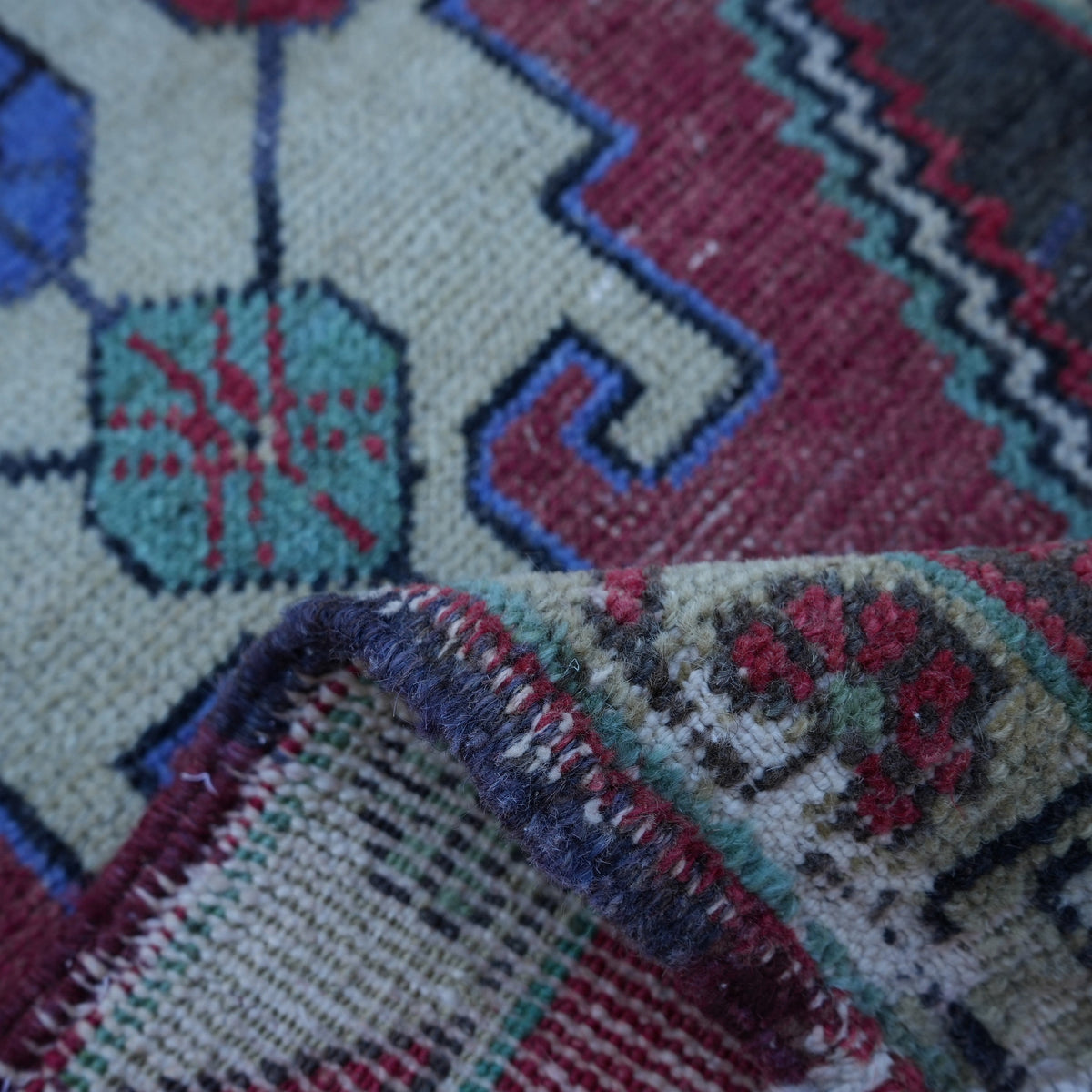Additional view of the red vintage turkish rug, hand-knotted in wool and cotton.