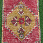 1970s red vintage turkish rug with traditional design, hand-knotted weave and low pile.
