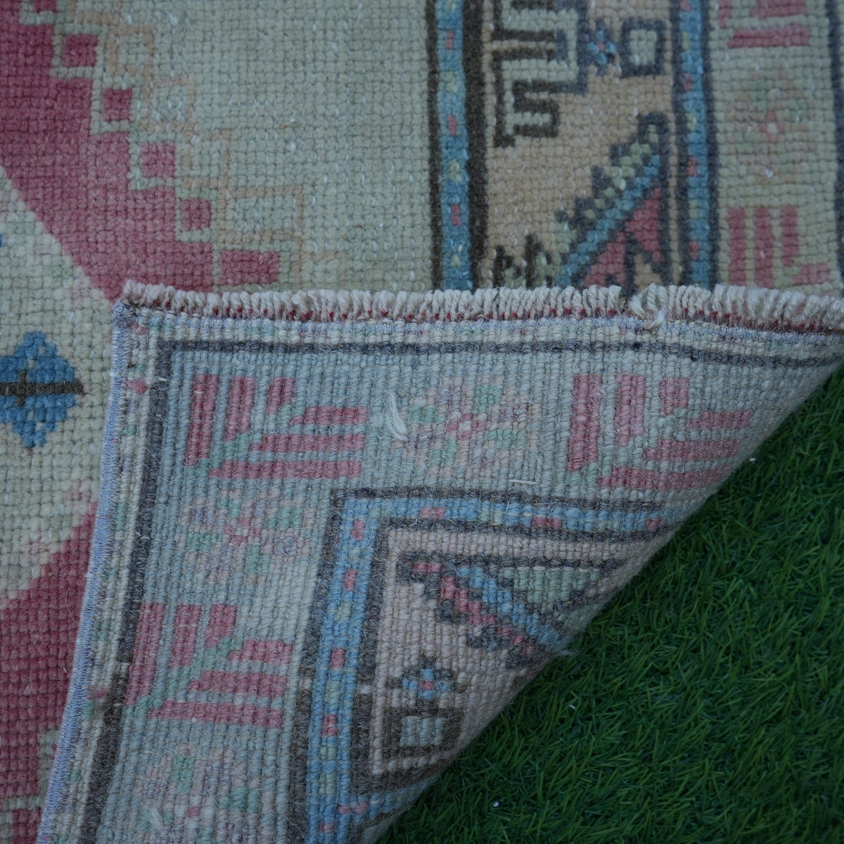 1970s red vintage turkish rug with traditional design, hand-knotted weave and low pile.