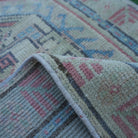 Additional view of the red vintage turkish rug, hand-knotted in wool and cotton.