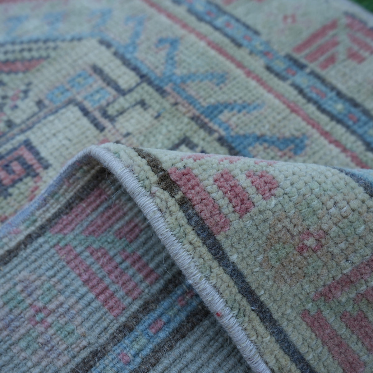 Additional view of the red vintage turkish rug, hand-knotted in wool and cotton.