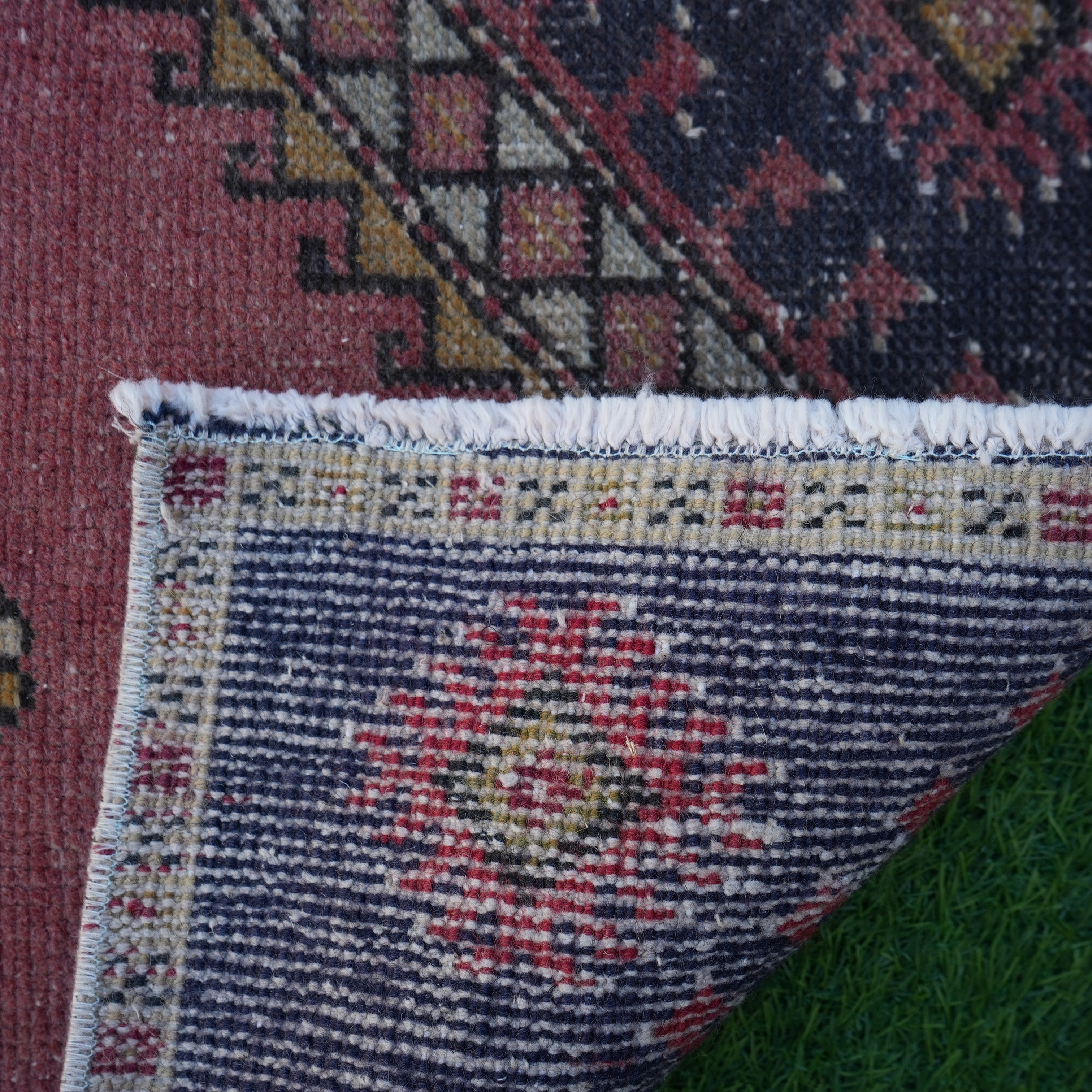 1970s red vintage turkish rug with traditional design, hand-knotted weave and low pile.