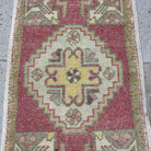 1970s red vintage turkish rug with medallion design, hand-knotted weave and low pile.