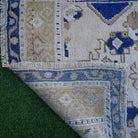 1970s blue vintage turkish rug with traditional design, hand-knotted weave and low pile.