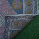 1970s pink vintage turkish rug with traditional design, hand-knotted weave and low pile.