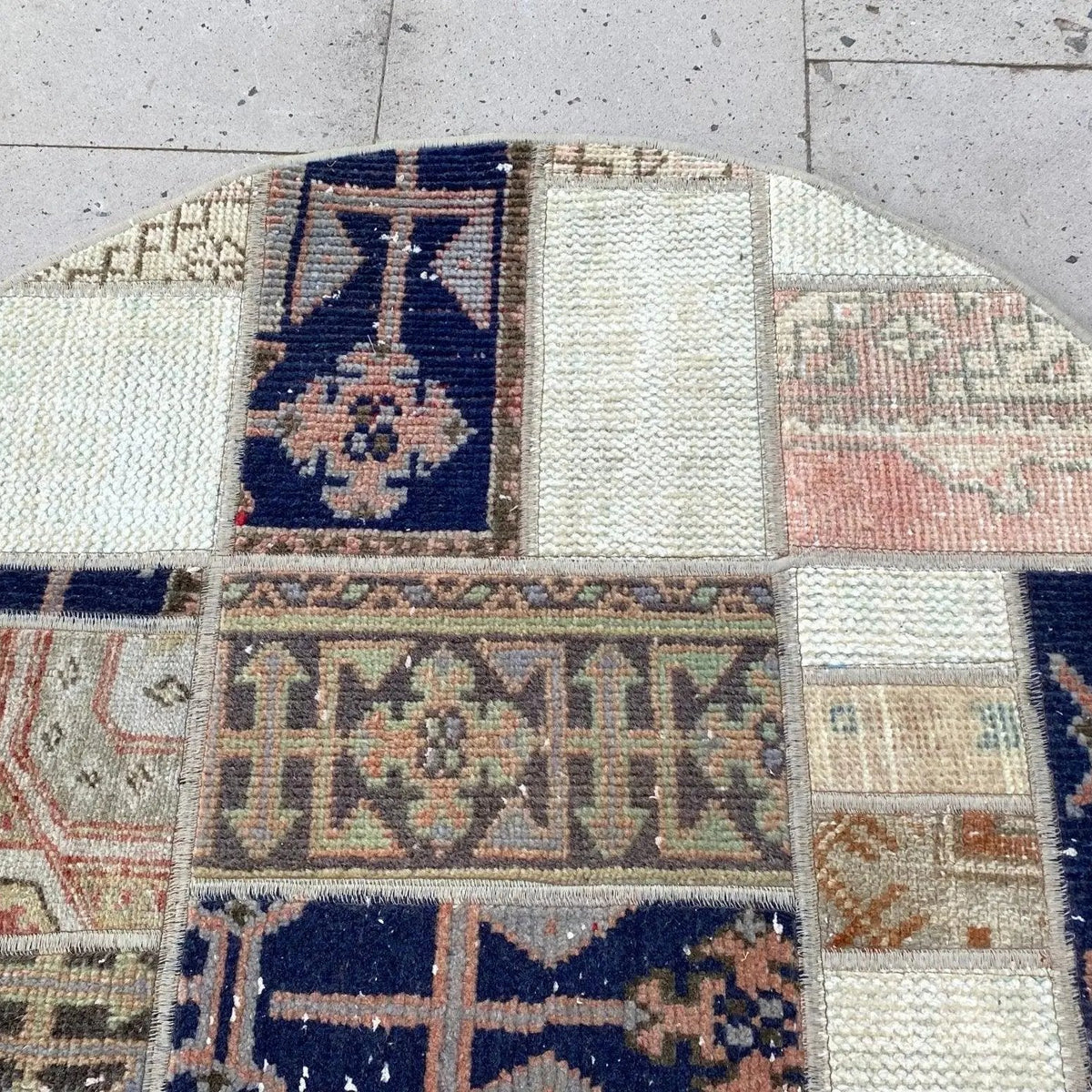 Blue 3' x 3' vintage turkish rug in wool and cotton, shown on the floor.