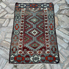 Blue 3' x 4' vintage turkish rug in wool and cotton, shown on the floor.