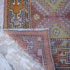 1970s orange vintage turkish rug with traditional design, hand-knotted weave and low pile.
