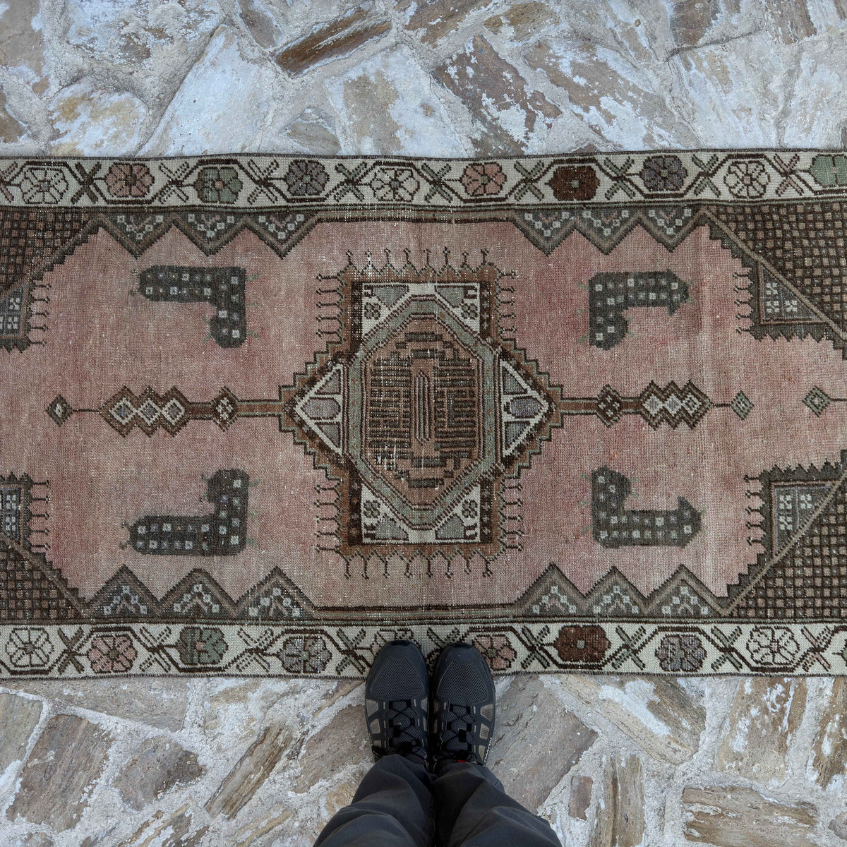 1970s pink vintage turkish rug with traditional design, hand-knotted weave and low pile.