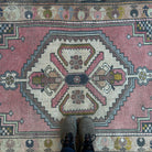 1970s pink vintage turkish rug with traditional design, hand-knotted weave and low pile.