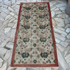Red 3' x 6' vintage turkish rug in wool and cotton, shown on the floor.