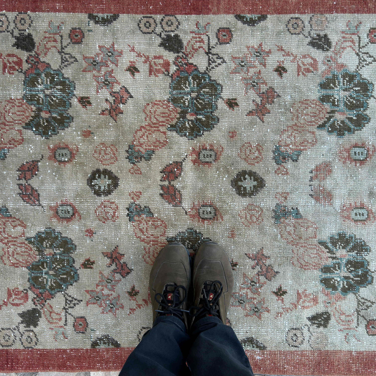 1970s red vintage turkish rug with floral design, hand-knotted weave and low pile.