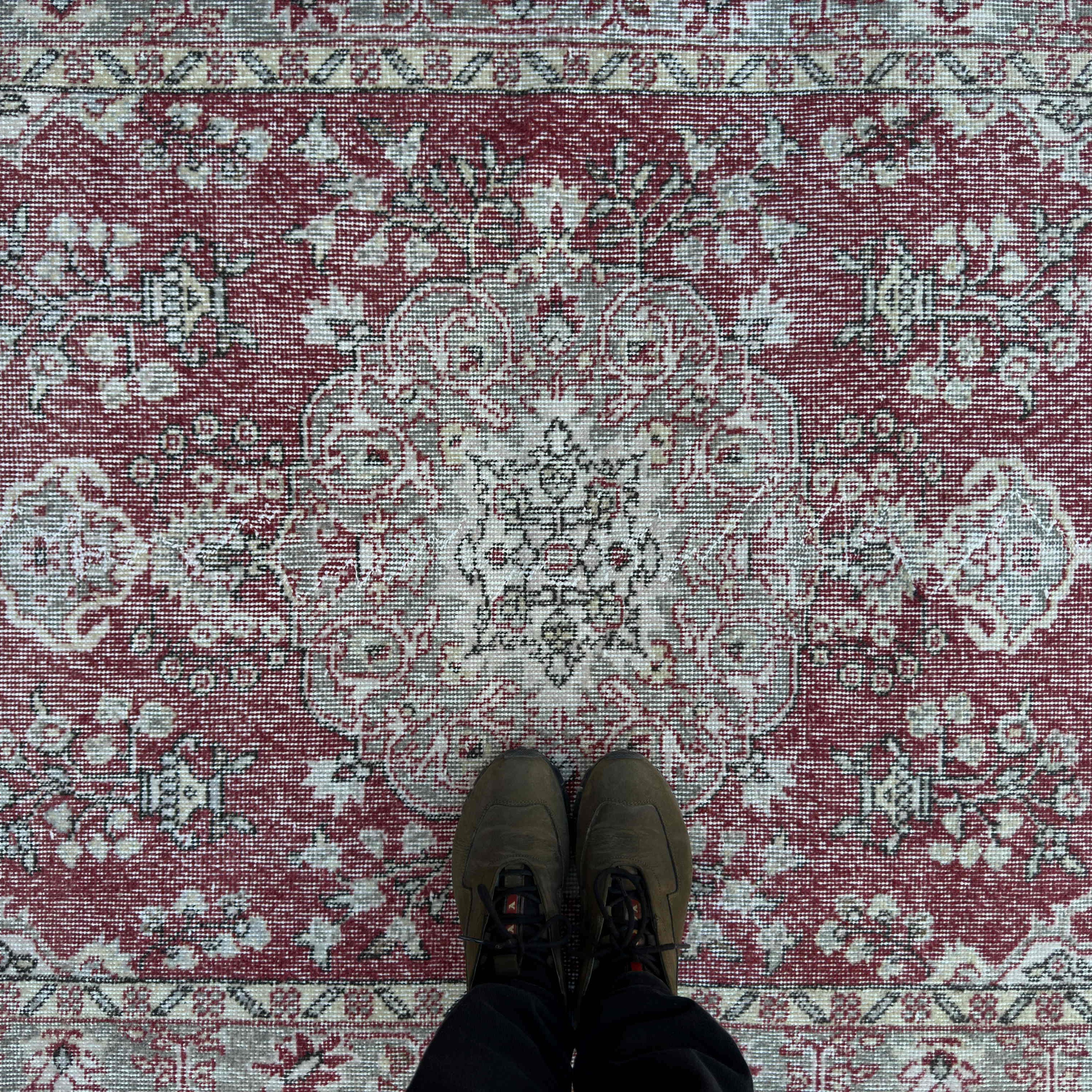 1970s red vintage turkish rug with traditional design, hand-knotted weave and low pile.