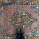 1970s red vintage turkish rug with geometric design, hand-knotted weave and low pile.