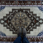 1970s blue vintage turkish rug with traditional design, hand-knotted weave and low pile.