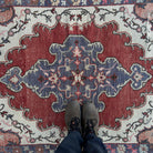 1970s multicolor vintage turkish rug with geometric design, hand-knotted weave and low pile.