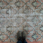 1970s pale orange vintage turkish rug with geometric design, hand-knotted weave and low pile.