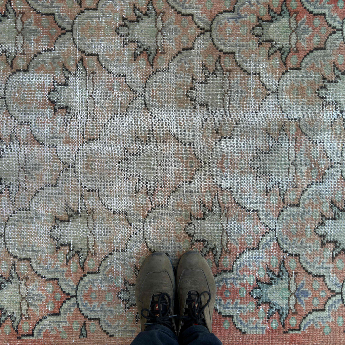 1970s pale orange vintage turkish rug with geometric design, hand-knotted weave and low pile.