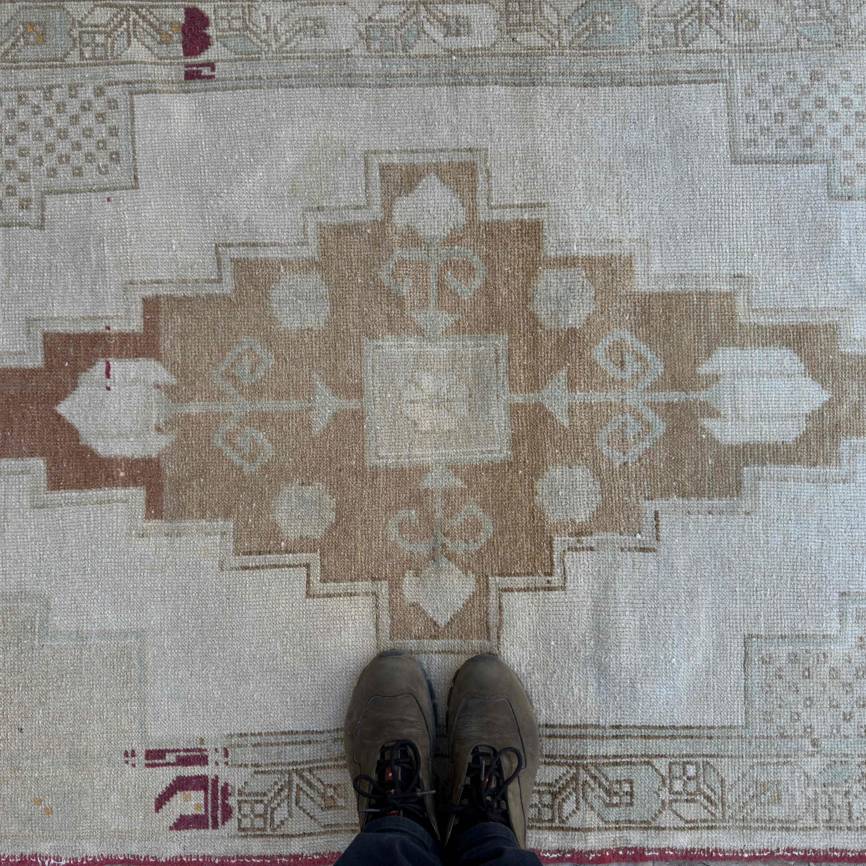 1970s brown vintage turkish rug with neutral design, hand-knotted weave and low pile.