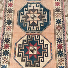 1970s pink vintage turkish rug with oushak design, hand-knotted weave and low pile.