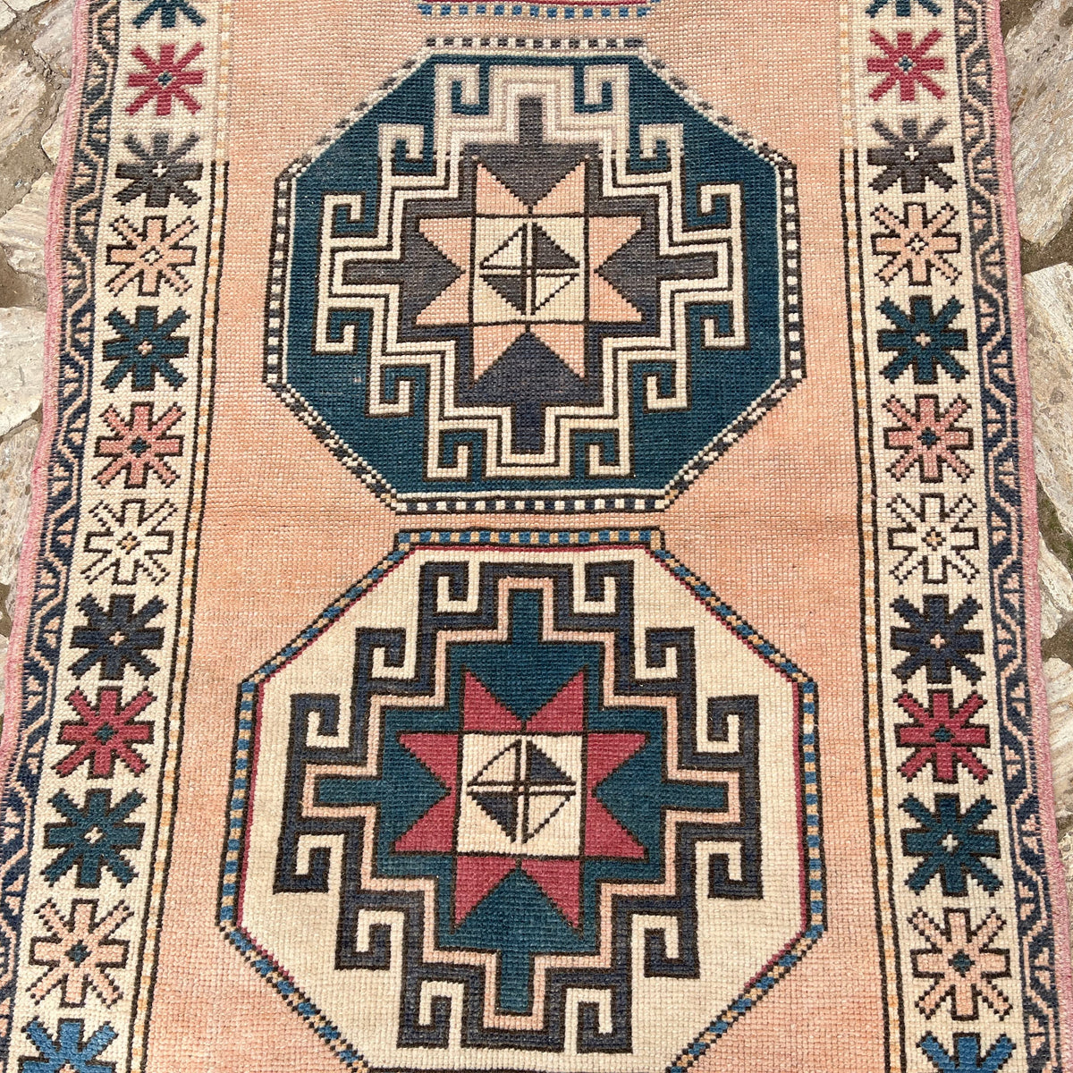 1970s pink vintage turkish rug with oushak design, hand-knotted weave and low pile.