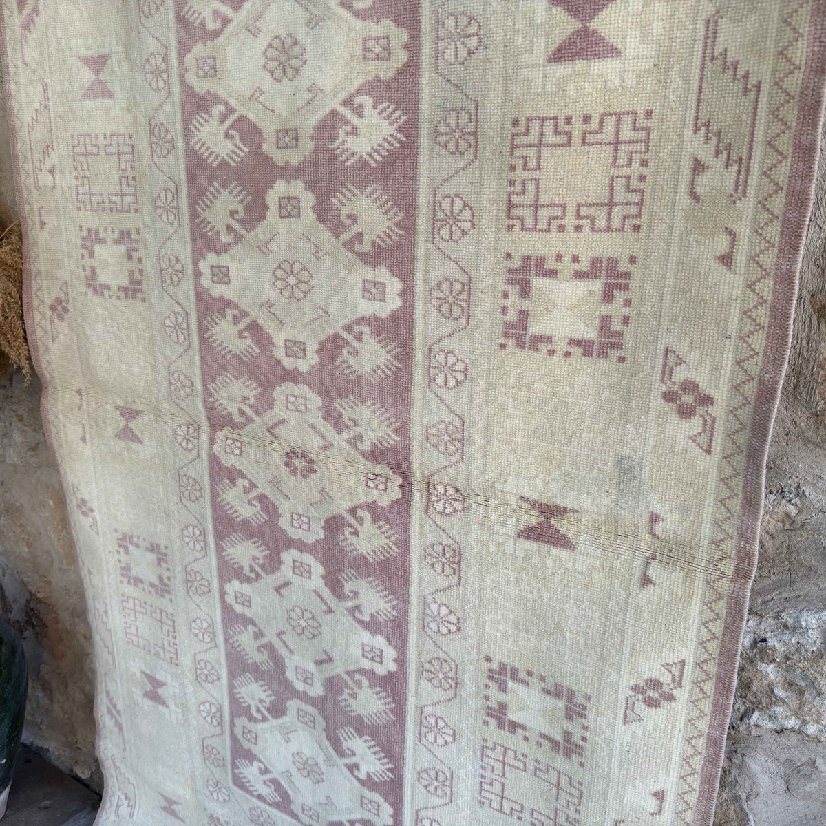 Beige 4' x 6' vintage turkish rug in wool and cotton, shown on the floor.