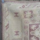 1970s beige vintage turkish rug with neutral design, hand-knotted weave and low pile.