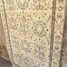 1970s brown vintage turkish rug with neutral design, hand-knotted weave and low pile.