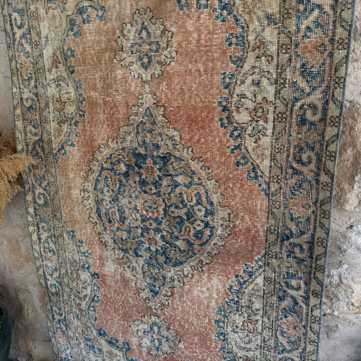 1970s orange vintage turkish rug with medallion design, hand-knotted weave and low pile.