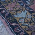 Red 4' x 6' vintage turkish rug in wool, shown on the floor.