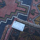 Red 4' x 6' vintage turkish rug from the 1970s with traditional design.