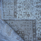1970s beige vintage turkish rug with neutral design, hand-knotted weave and low pile.