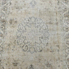 1970s beige vintage turkish rug with medallion design, hand-knotted weave and low pile.