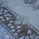 Beige 4' x 7' vintage turkish rug in wool and cotton, shown on the floor.