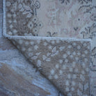 1970s beige vintage turkish rug with traditional design, hand-knotted weave and low pile.