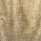 Beige 4' x 7' vintage turkish rug in wool and cotton, shown on the floor.